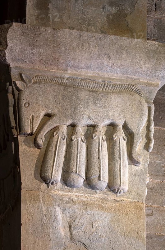 Gropina, Pieve San Pietro di Gropina, capital next to the west portal: pig suckling piglet