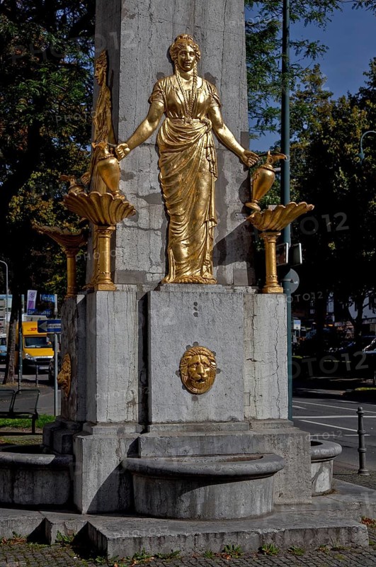 Aachen drinking fountain HOTMANNSPIEF Erected 1825-30 Obelisk made of bluestone with four identical gilded cast-iron female half-relief figures by Adam Franz Friedrich Leydel