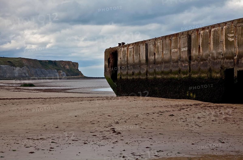 Channel coast with relics of the allied MULBERRY landing party on the sixth of June 1944, so-called D-Day