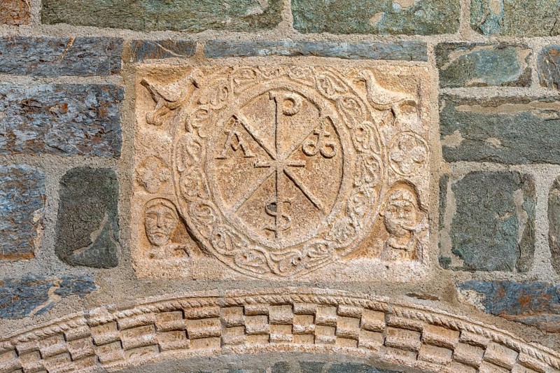 Coll, Santa Maria de l'Assumpció, west portal with Christ's monogram