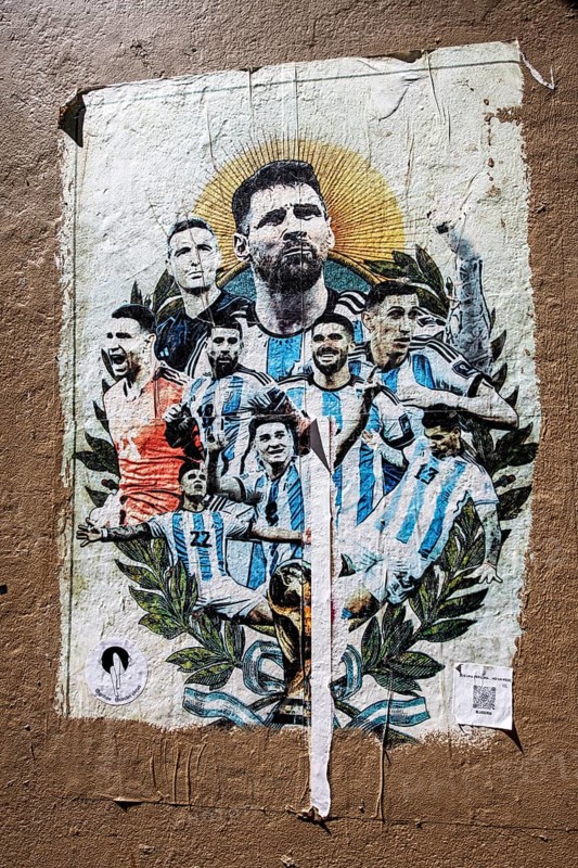 Lionel Messi with the Argentinian national team on a poster on a house wall at El Caminito, La Boca, Buenos Aires, ArgentinaBuenos Aires, Argentina, South America