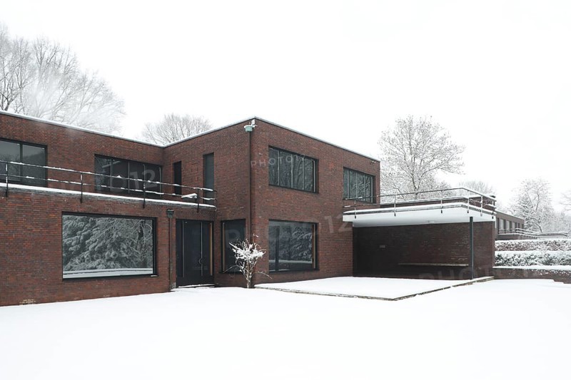 Built between 1928 and 1930 by Ludwig Mies van der Rohe as a residential building, garden side