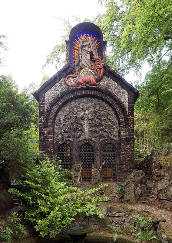Garden of Redemption, chapel with the theme of redemption from evil, gable field with two trees of paradise, the tree of life with angel heads instead of apples and, as a counterpart, the tree of knowledge bearing skulls, above it the apocalyptic sun woman from chapter 12 of the Revelation of John, who is threatened by the 7-headed dragon (symbolising Satan), St., Sankt, Saint