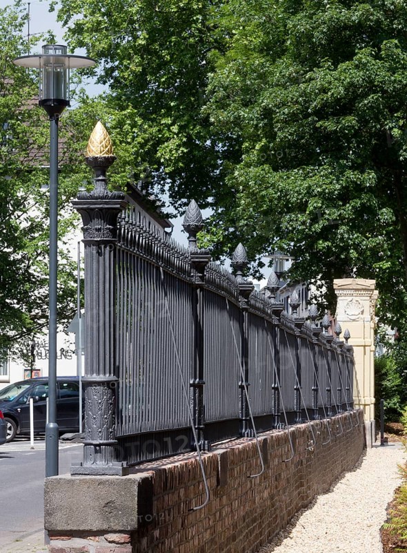 Restored wall and Tor tor to the park, golden pine cone