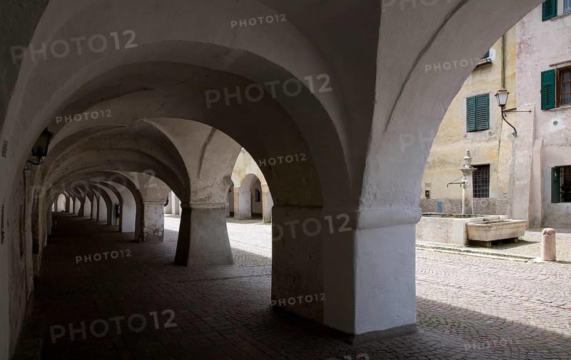 Italy S-Tyrol Neumarkt. Laubengasse with a view of the alleyway fountain