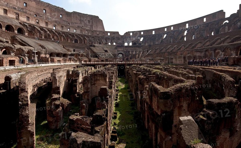 Interior with wall remains below the former arena