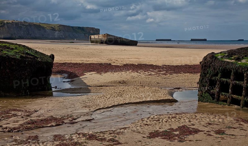 Channel coast with relics of the allied MULBERRY landing party on the sixth of June 1944, so-called D-Day