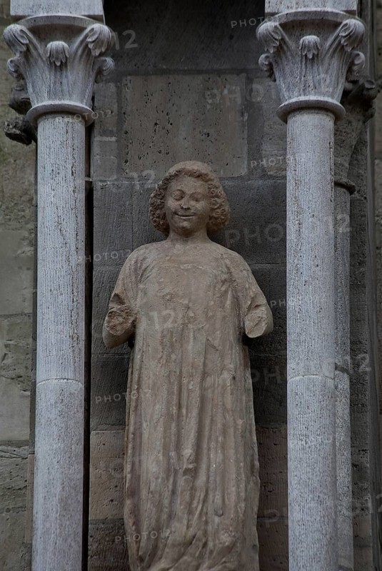 Sculpture of a youth in the central buttress canopy on the north side of the three western nave bays, St., Sankt, Saint