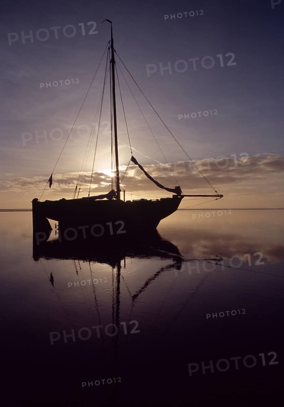 Wadden Sea, natural landscape. Sailing ship fell dry