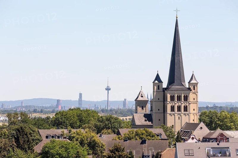 Brauweiler near Pulheim, St Nicholas Abbey Church, view from the west, Cologne with television tower and Cologne Cathedral in the background
