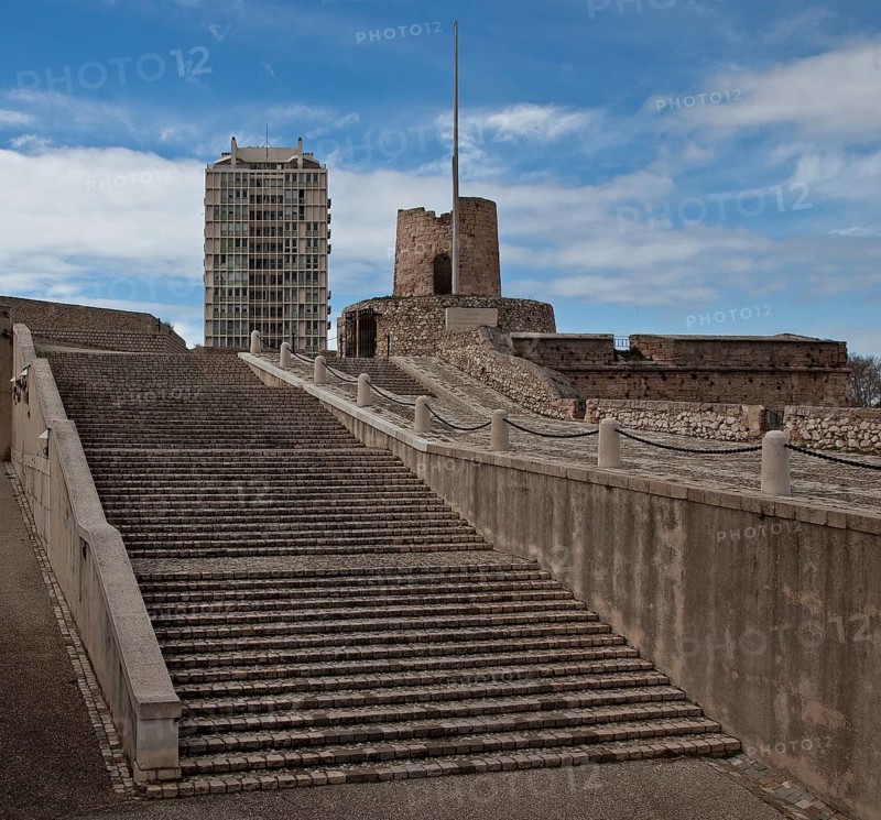 Staircase and ramp to the town, battery tower and modern tower block above