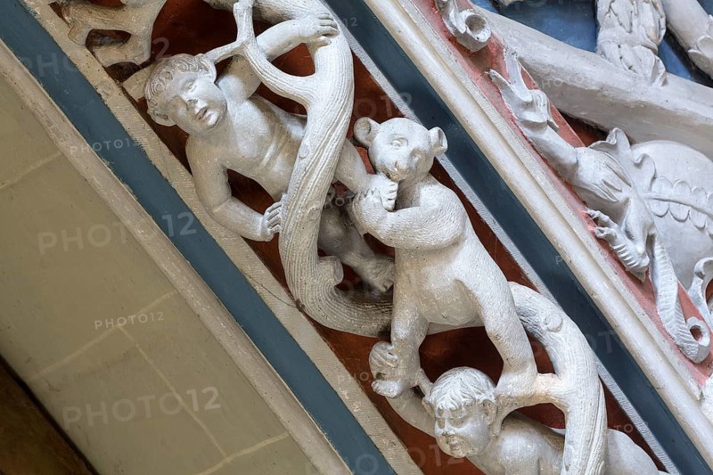 Constance, Minster, west gallery around 1516, masks and animals, bear bites child's foot