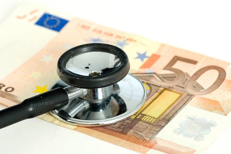Stethoscope on fifty-euro note, sick currency, exchange rate, sick euro