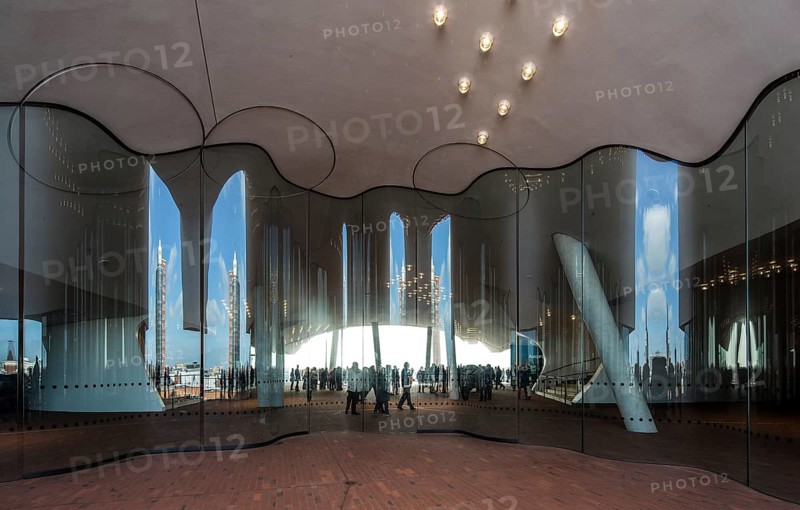 Hamburg, Elbphilharmonie, foyer called Plaza, wave-shaped glass wall to separate the Plaza into outdoor and indoor areas, designed by Herzog & de Meuron, built 2007-2016