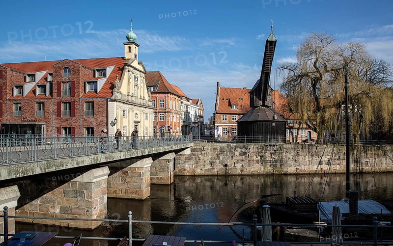 Lüneburg Old Crane 93433 built in 1797 with inner pedal wheel on the banks of the Ilmenau in operation until 1860 left Facade of the old department stores'