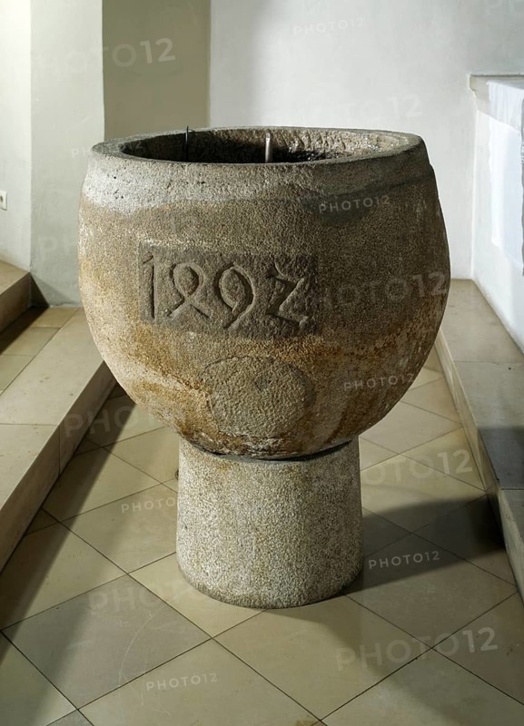 Baptismal font from 1492, heavily reworked