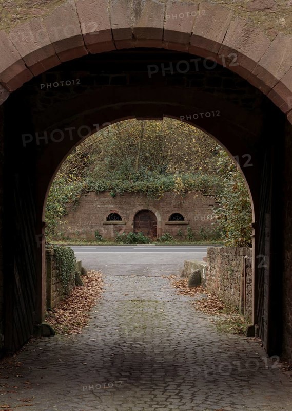 Former Cistercian nunnery Himmelthal in Spessart. Founded in 1232, the present church dates from 1753 and is now the Elsava School. View through the gatehouse to a cellar, St., Sankt, Saint