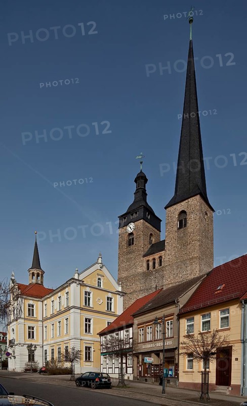 Castle near Magdeburg, upper church and town hall. Burg Oberkirche Unser Lieben Frauen 12th century towers seen from west-south-west over the houses on Breiter Weg left Town Hall early 18th century and late 19th century, St., Sankt, Saint