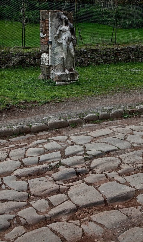 Stele of a naked youth in front of an antique pavement