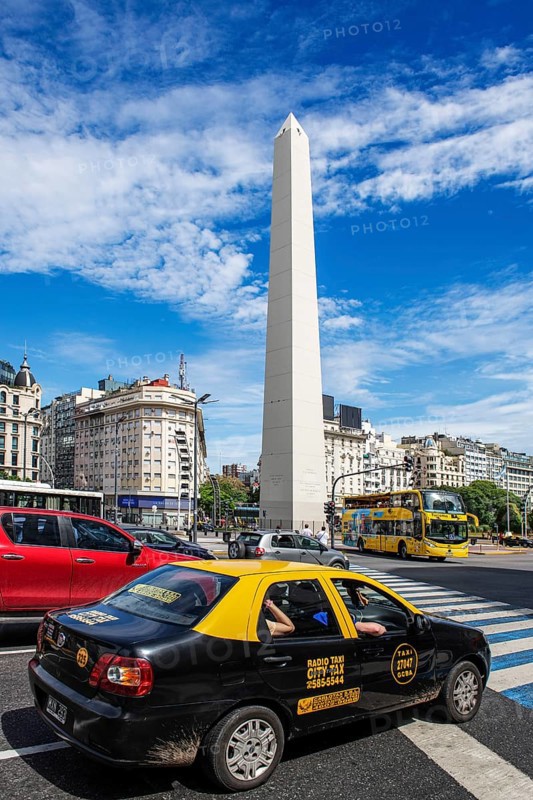 Obelisk and taxi at the Plaza de la Republica, Avenida 9 de Julio, Buenos Aires, Argentina, South America