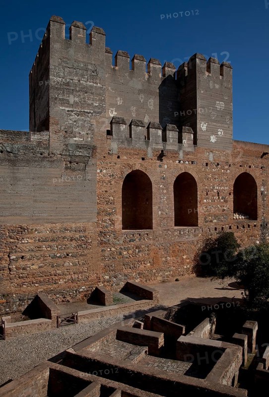 Alcazaba fortress, inner courtyard with Torre Quebrado, building floor plans exposed below