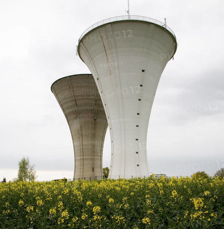 Bresse, 2 identical water towers one behind the other in the rape field
