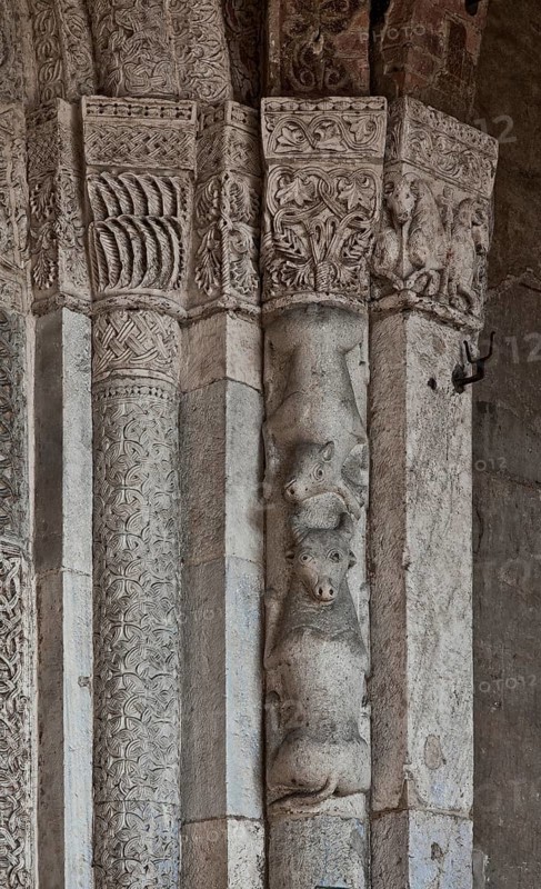 Italy Milan Milan Church of San Ambrogio 12th century Narthex bundle pillars and stepped vaulted portal with animal and plant sculptures and columns with interlaced bands, St., St., Saint