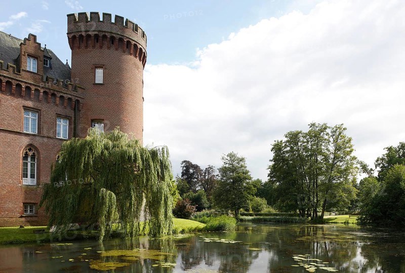 West tower and castle pond in the evening light