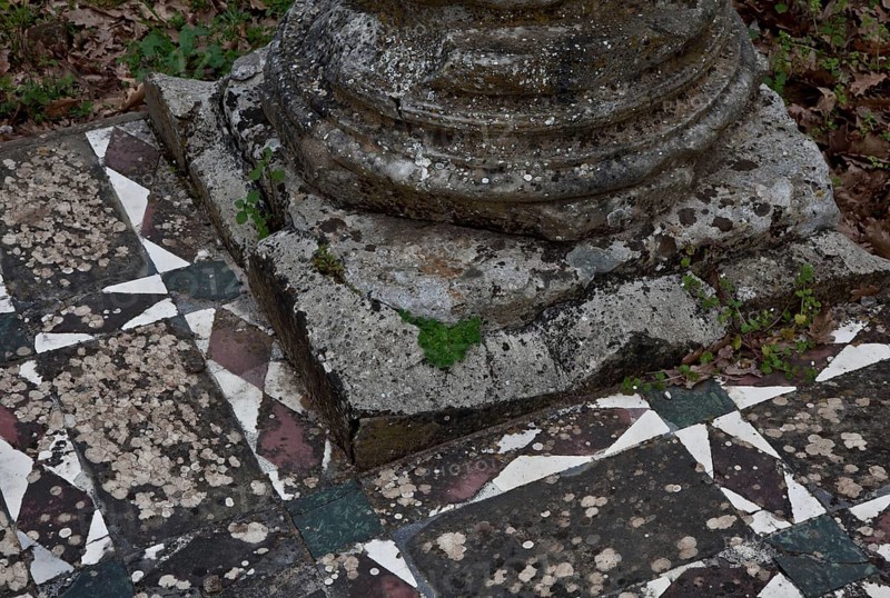 Column base on mosaic floor