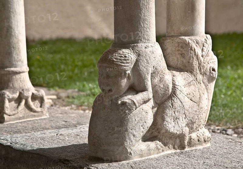Eastern cloister wing, column base, Woman biting the lion's tail, St., Saint, Saint