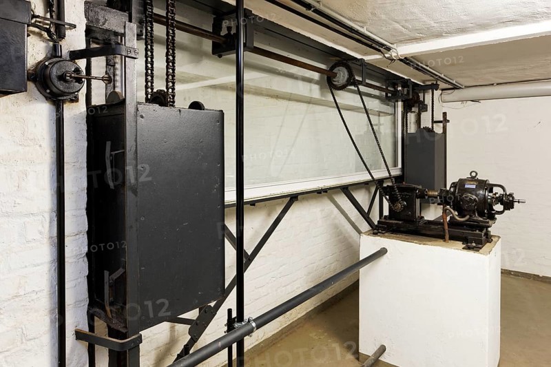 Cellar under the ladies' room, restored mechanism for lowering the large window to the garden, half-open condition