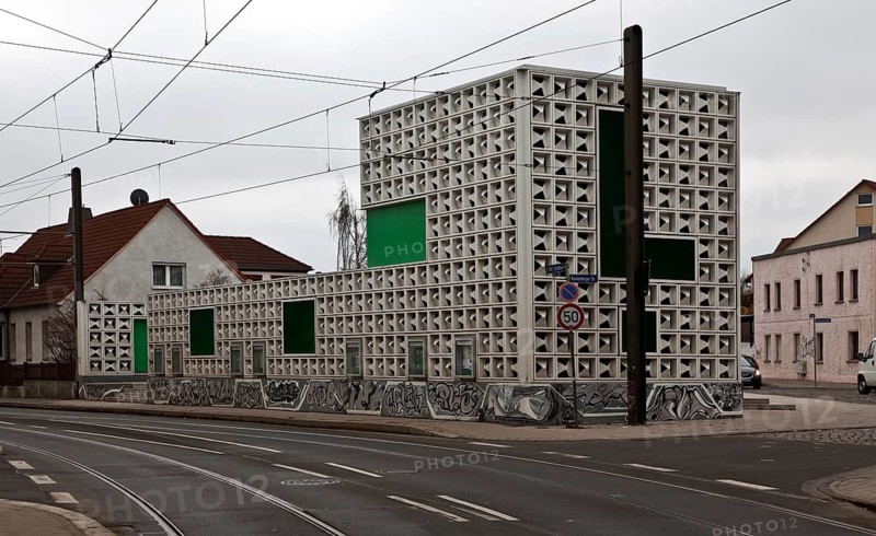 Open-air library LESEZEICHEN from the north-east, project of the International Building Exhibition IBA. The Salbke bookmark is a public building in the Salbke district of Magdeburg. The bookmark is a combination of public bookcase, event stage and noise protection. Eiermann façade