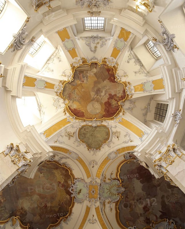 Vault of the northern transept arm. The Vierzehnheiligen Basilica near Bad Staffelstein in the district of Lichtenfels is a pilgrimage church in Upper Franconia. The church, built according to plans by Balthasar Neumann, is dedicated to the Fourteen Holy Helpers and receives around half a million visitors a year