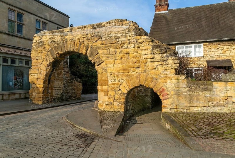 Newport Arch on Ermine Street, Roman entrance gateway to city of Lincoln, Lincolnshire, England, UK