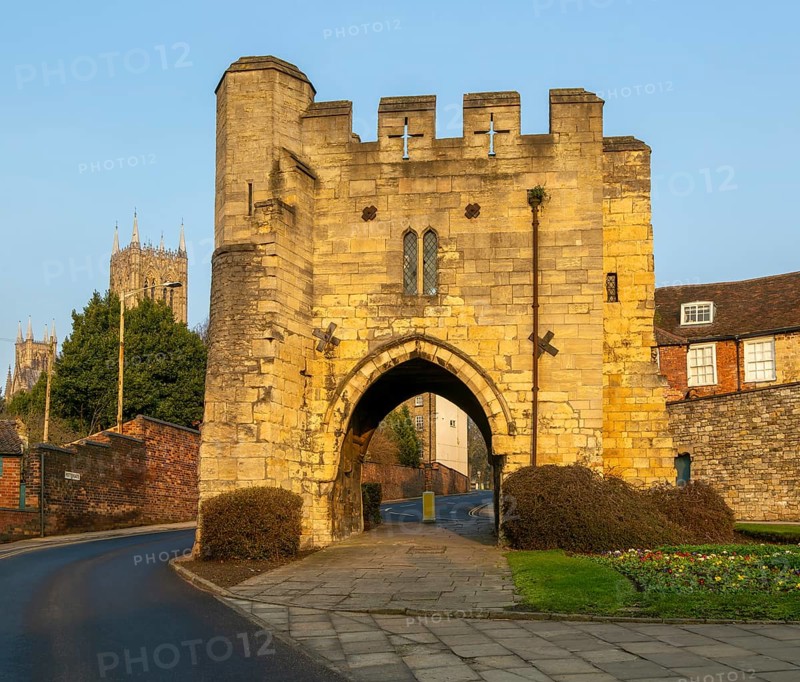 Pottergate medieval stone archway entrance to cathedral area in city of Lincoln, Lincolnshire, England, UK