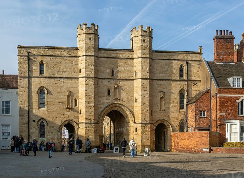 Sun shining on Exchequer Gate, Minster Yard, city of Lincoln, Lincolnshire, England, UK