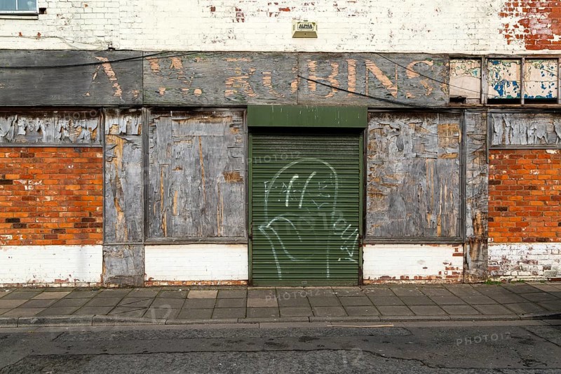 Derelict closed boarded-up shop, Pasture Street, Grimsby, north east Lincolnshire, England, UK