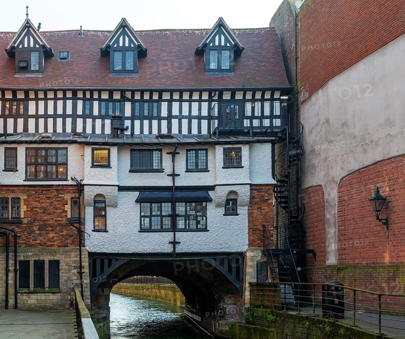 Timber framed buildings on historic High Bridge over River Witham, Lincoln, Lincolnshire, England, UK view from the west