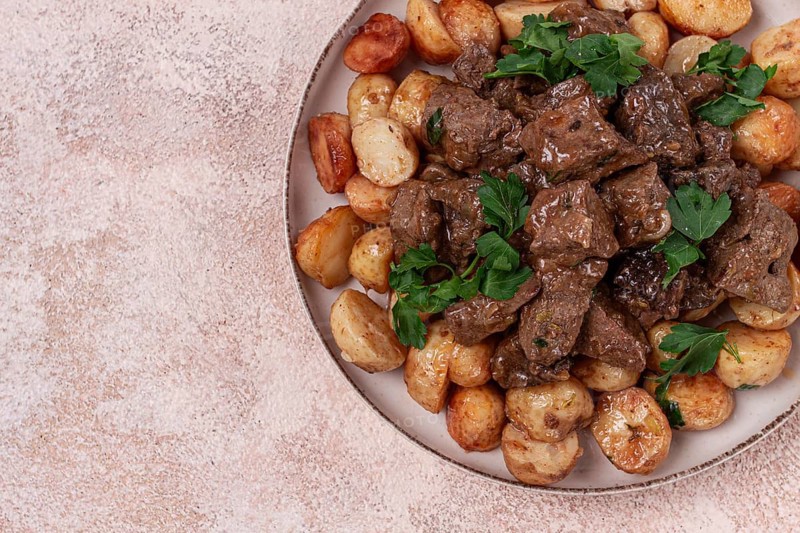 Kuyrdak, roast offal with potatoes and fresh herbs, homemade in Kazakh, no people