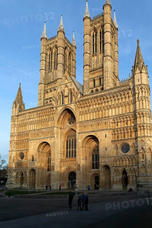 West frontage of cathedral church in evening light, Lincoln, Lincolnshire, England, UK