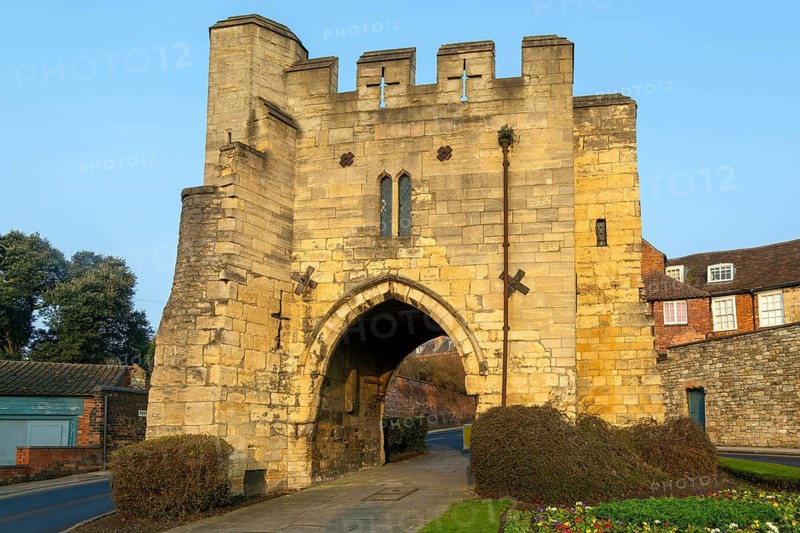 Pottergate medieval stone archway entrance to cathedral area in city of Lincoln, Lincolnshire, England, UK