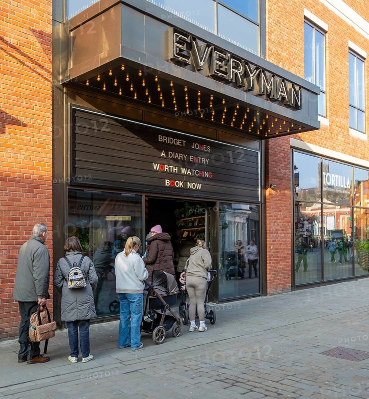 People queuing outside Everyman Cinema, Cornhill Quarter shopping area in city centre, Lincoln, Lincolnshire, England, UK