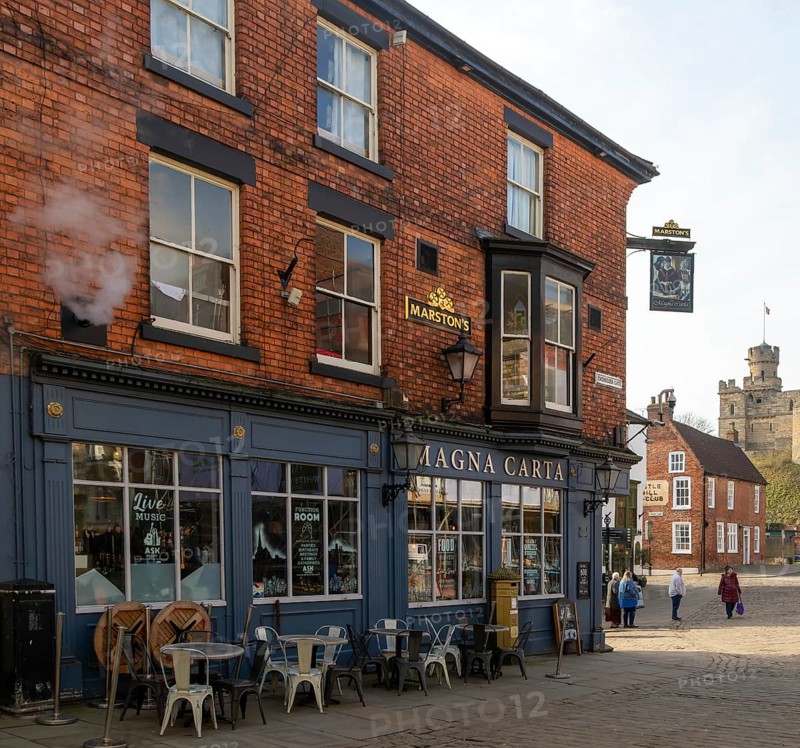 Magna Carta pub on Castle Hill, city of Lincoln, Lincolnshire, England, UK view to Observatory Tower of castle