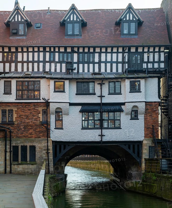 Timber framed buildings on historic High Bridge over River Witham, Lincoln, Lincolnshire, England, UK view from the west