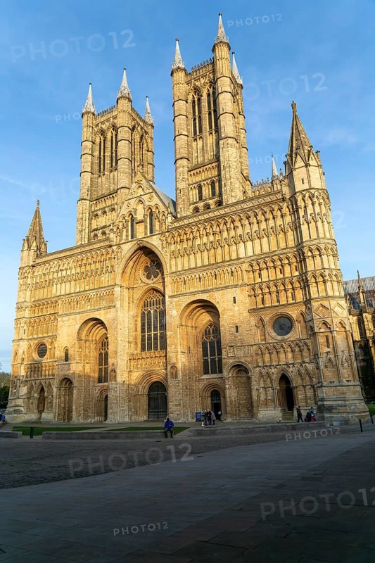West frontage of cathedral church in evening light, Lincoln, Lincolnshire, England, UK