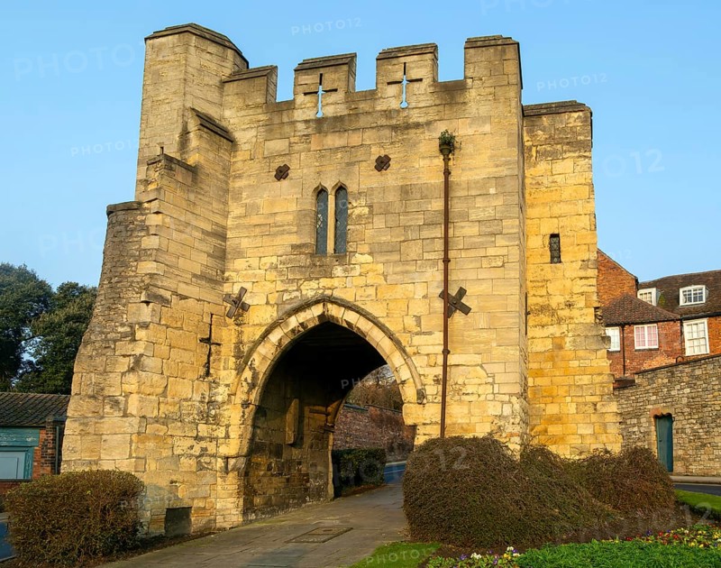 Pottergate medieval stone archway entrance to cathedral area in city of Lincoln, Lincolnshire, England, UK