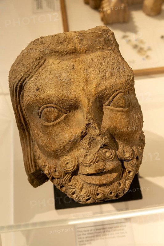 Discovery Centre inside Lincoln cathedral church, city of Lincoln, Lincolnshire, England, UK bearded man 900 year old carved face