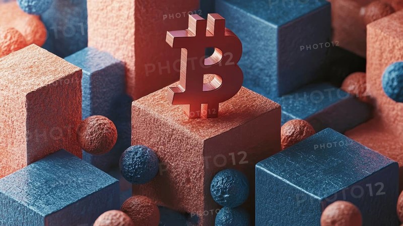 This conceptual shot showcases an arrangement of textured geometric shapes in shades of blue and coral, punctuated by small spheres. At the center, a metallic symbol stands out atop a block, AI generated