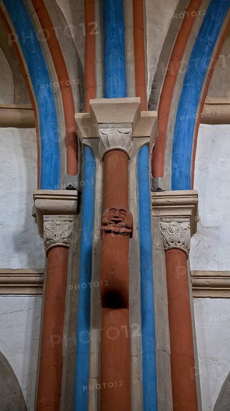 Goslar Neuwerkkirche 75040 Colourfully painted services on a main pillar of the central pillar formed into an eyelet and set with a lion mask