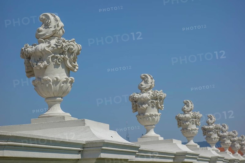 Row of artistically designed stone vases on an arcade in front of a bright blue sky, bratislava, danube, slovakia